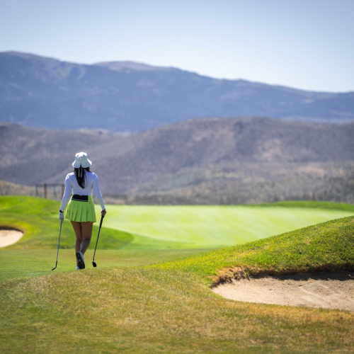 Arrow-Creek-Golf-Club-with-golfer-caring-clubs