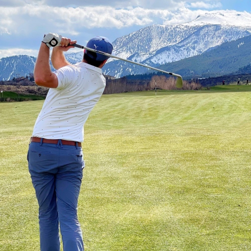 Golfer at ArrowCreek with Mount Rose in the Background