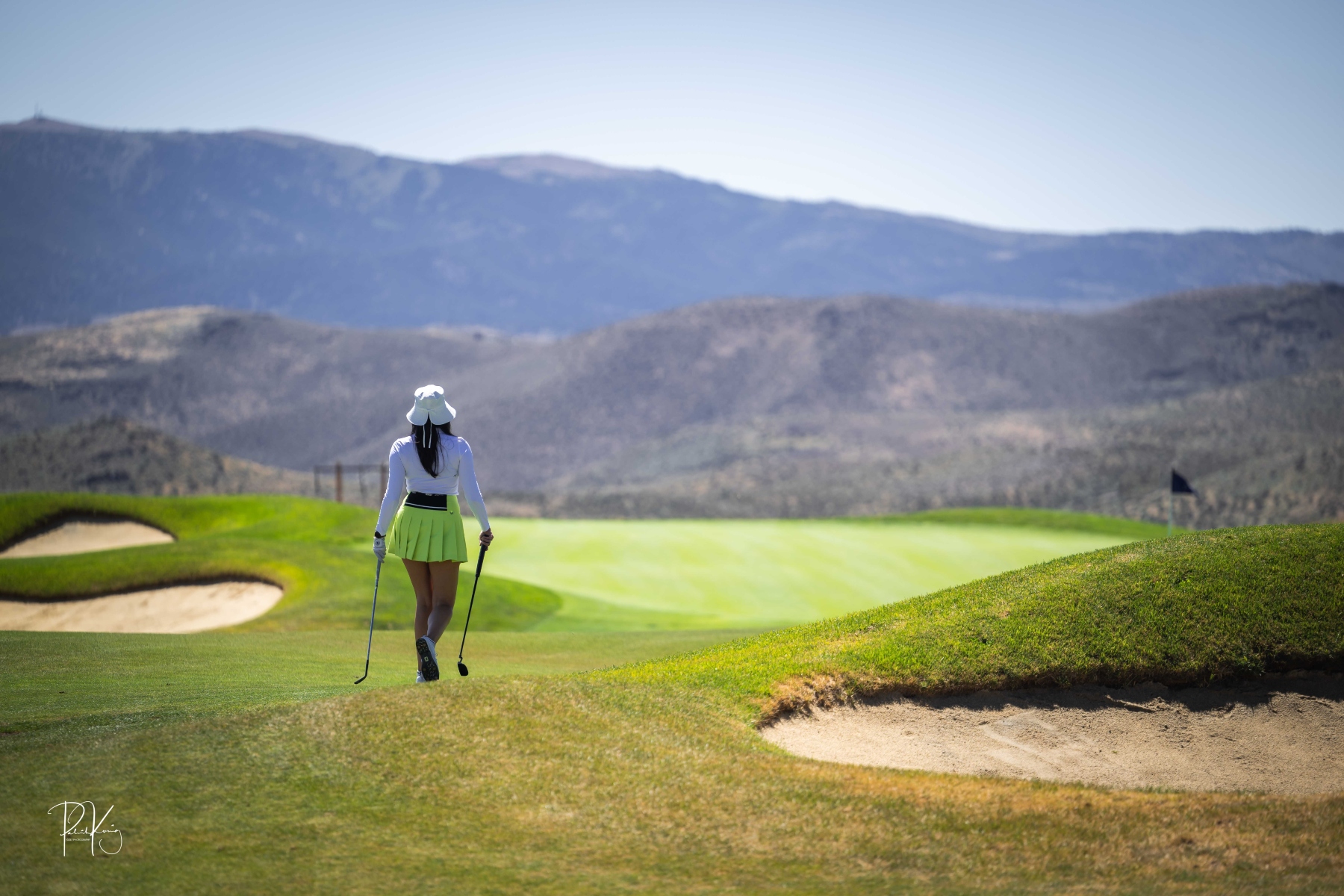 Arrow Creek Golf Club with golfer caring clubs