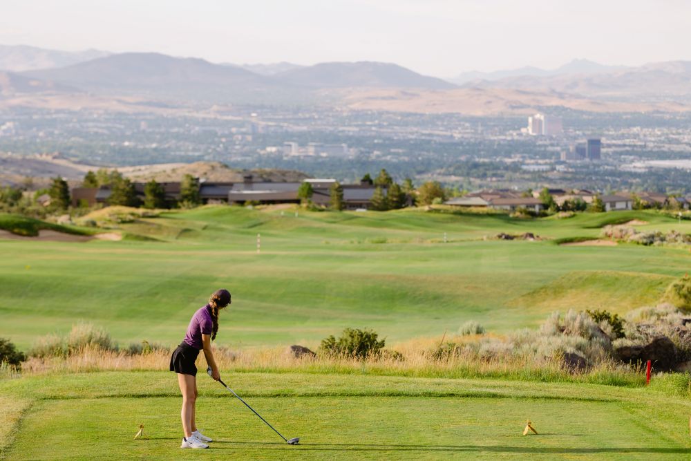 Golfer teeing off on The Club at ArrowCreek's Challenge Course