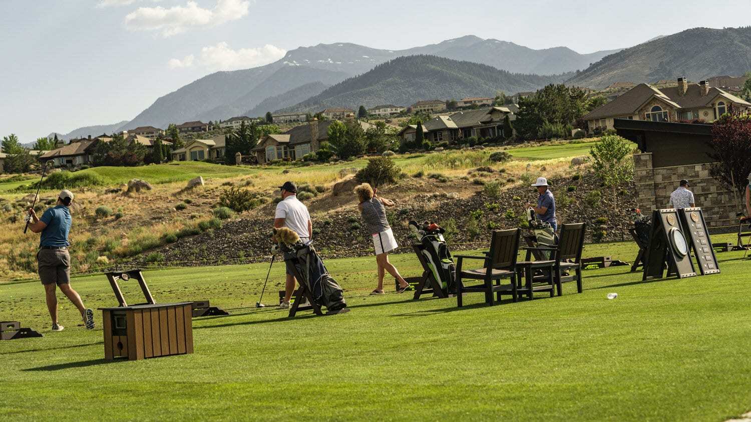 Members-enjoying-golf-practice-with-scenic-mountain-views-at-The-Club-at-ArrowCreek